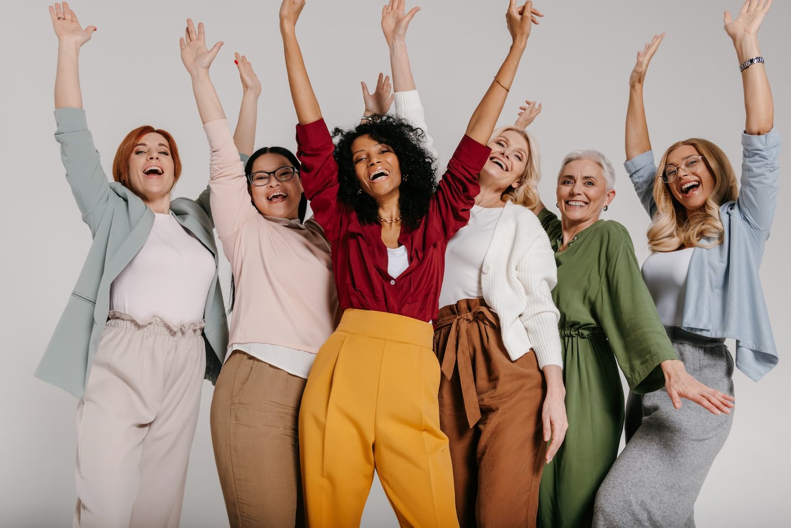 Group of diverse, healthy women celebrating vibrant health and medical weight loss triumph at Udi Health